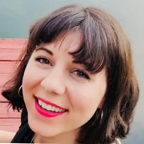 Woman with short hair wearing hoop earrings